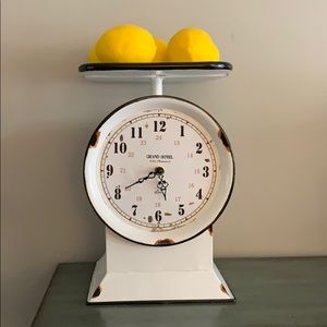 Fake scale with fake clock and fake lemons